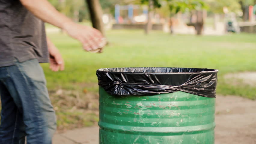 Throwing Away Garbage In Public Trash Can Stock Footage Video 10758917 Throw The Trash In The Trash Cane