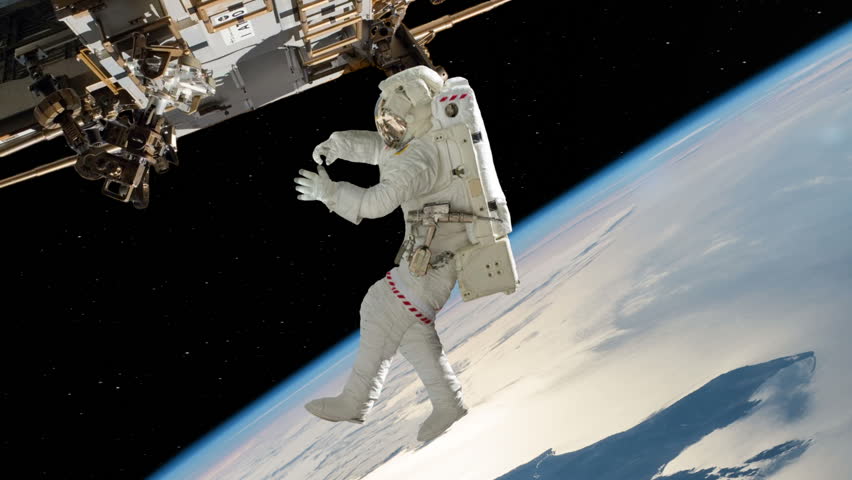 Astronaut Spacewalk Working On International Space Station Stock