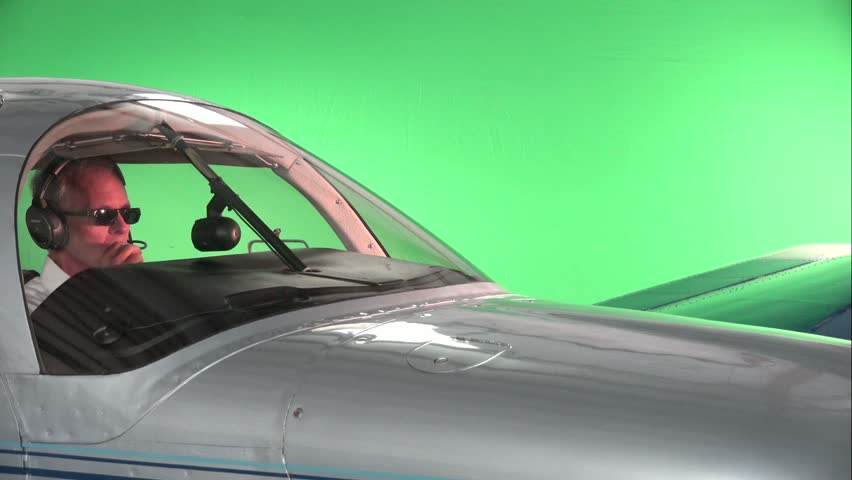 Pilot Is Flying Airplane, Green Screen Background, Quater Angle, Wide 