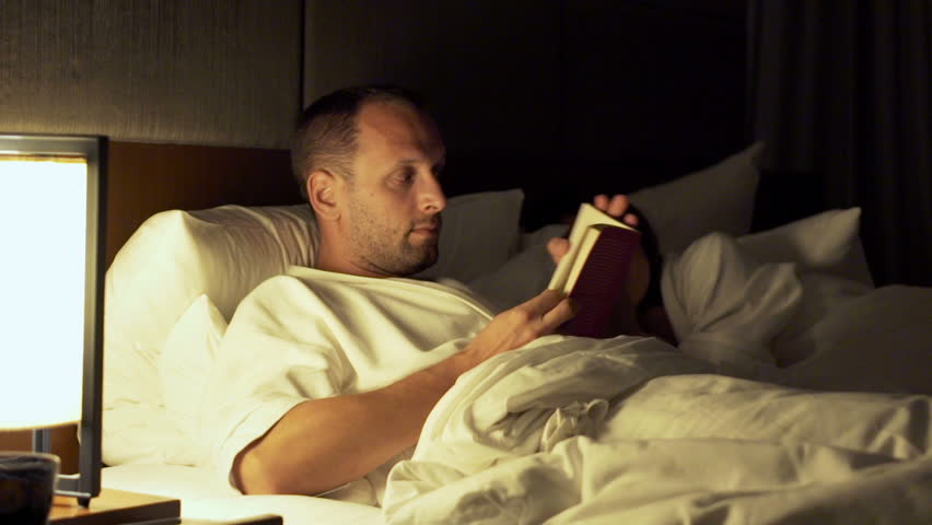 how to read a book in bed young woman reading book lying on bed late at night at how to read a book in bed young woman reading book lying on bed late at night at