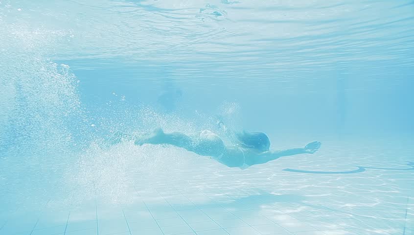 Beautiful Girl In A White Bikini Swimming In The Pool 