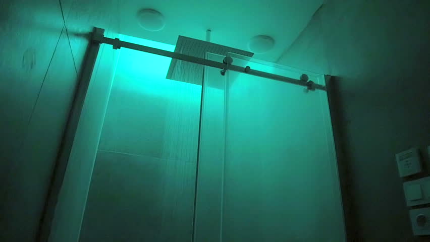 Naked Woman Taking A Shower Behind Glass Screen In A Bathroom Slowmation Camera Moving