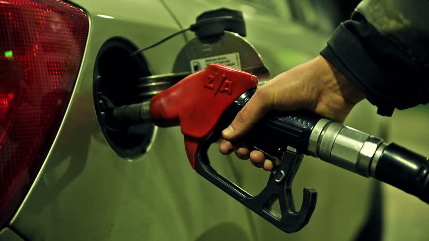 Filling Up Car Gas Tank With Fuel At Station Closeup On Hand And Pump