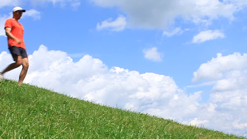 Man Walking Uphill Stock Footage Video 2130764 Shutterstock