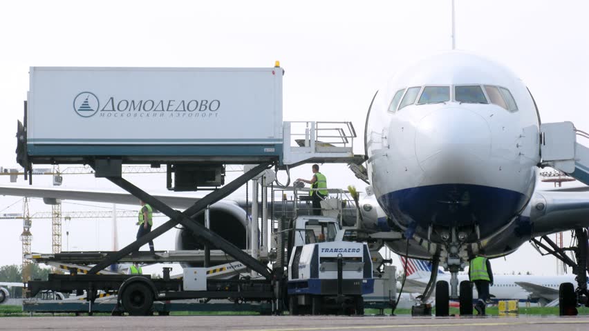 MOSCOW - MAY 22: (Timelapse View) Workers Unload Cargo From Plane, On ...