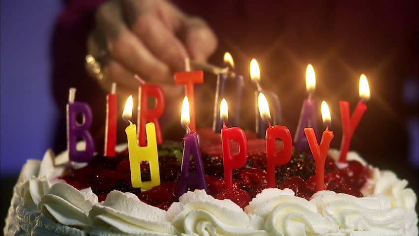 blowing candles birthday cake