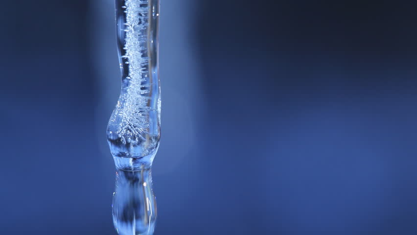 Extreme Macro Close Up Of A Single Icicle Melting And Dripping Water