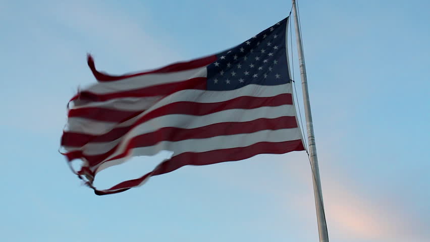 A Torn And Tattered American Flag Waves In The Wind Stock Footage Video 