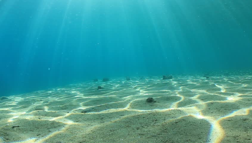 Underwater HD Video Of Dappled Sunlight On Ocean Floor Stock Footage