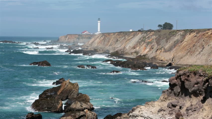 Rough Ocean Surf Against Pacific At Point Arena Lighthouse Windy And Storm Coastal California