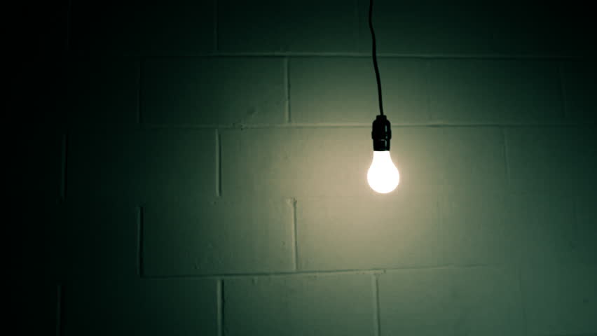 Abstract Swinging Light Bulb In Dark Room Stock Footage ...