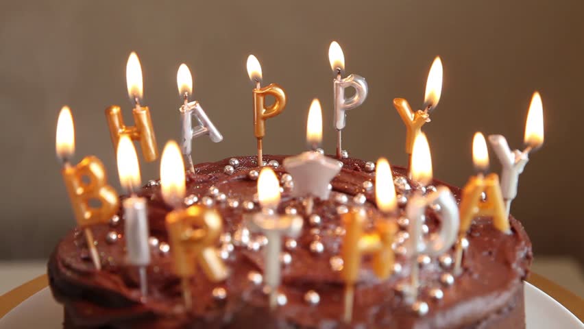 A Chocolate Birthday Cake With Candles Stock Footage Video ...