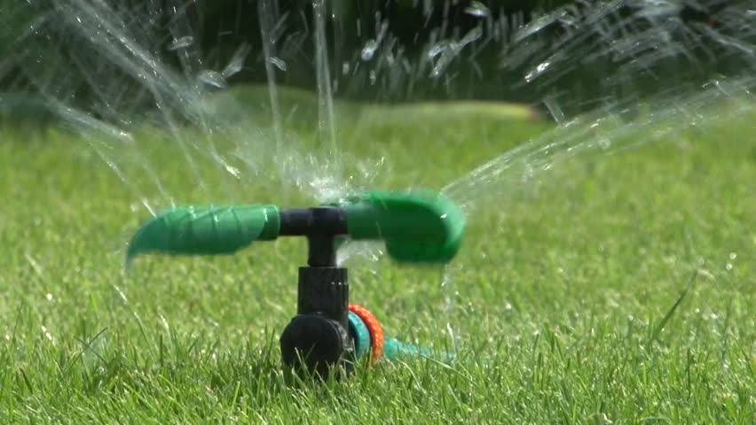 Sprinkler And Naked Child Running Through It Stock Footage 