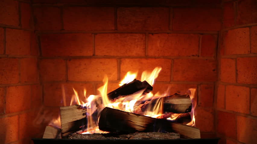 A Real Wood Fire Burning In A Clean Brick Fireplace. Stock Footage