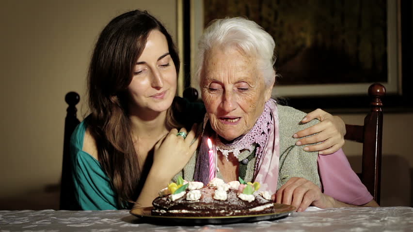 Happy Smiling Grandmother Celebrating And Giving A Birthday Cake To Her Grandson Stock Footage