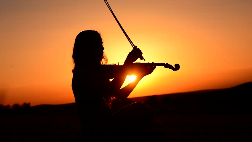 Woman Playing The Violin At Beautiful Sunset Stock Footage Video