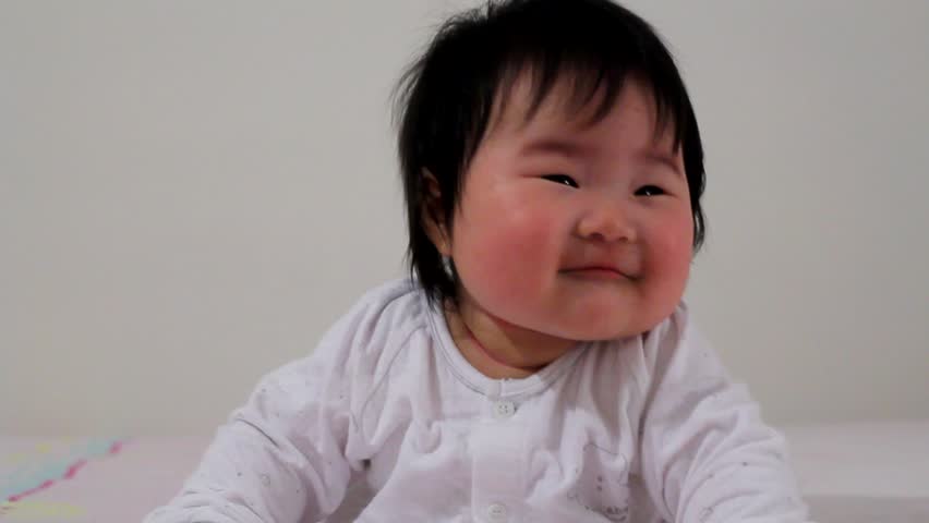 Cute Baby Infant Asian Girl Looking Around Stock Footage Video 726226