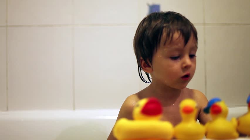 Adorable Little Boy Playing In The Bathtub With Rubber Ducks Hd