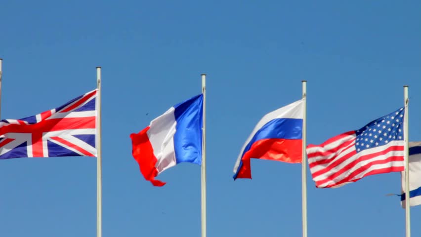 Flags Of Great Britain, France, Russia On Blue Sky Background Stock