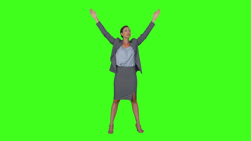 Happy Girl Jumping Up And Down On A Green Screen In Slow Motion Stock ...