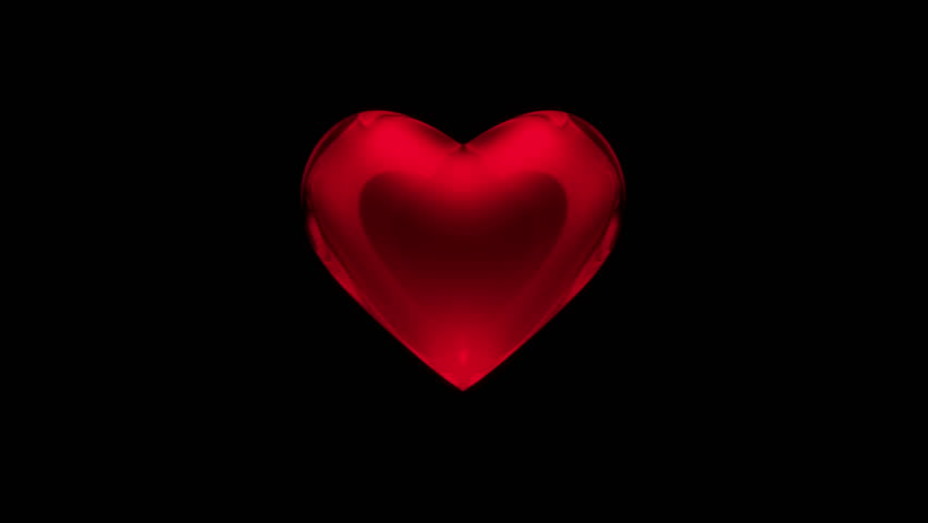 Pulsating Red Heart With The Light On An Isolated Black Background ...