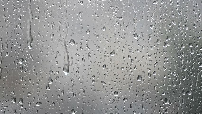 Close Up Of A Window With Rain Drops Falling Down Stock Footage Video ...