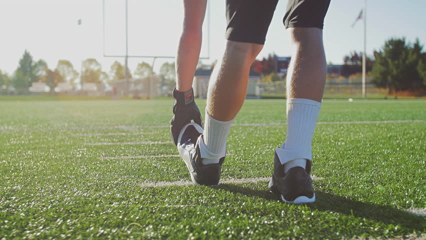 Football Players Stretching Before A Game Stock Footage Video 12452345 ...