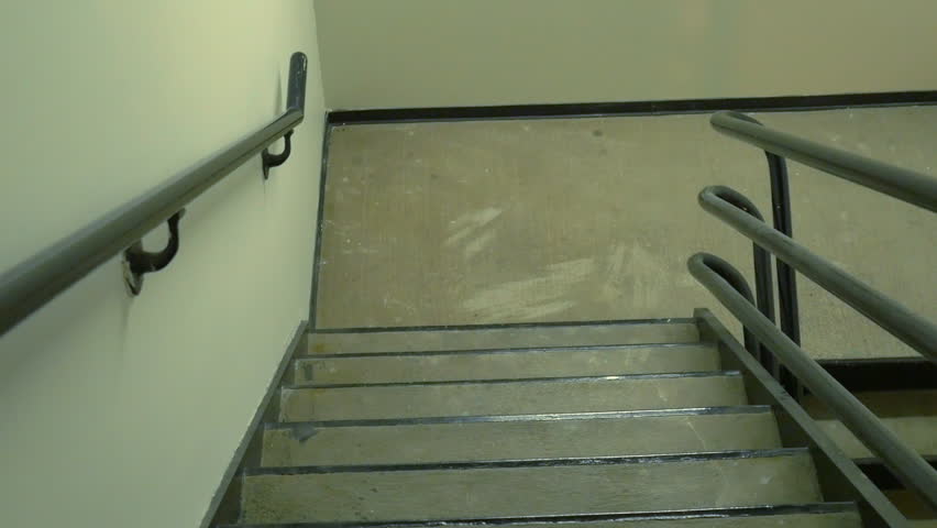 POV View Of Walking Down The Emergency Stairs In An Office Highrise ...