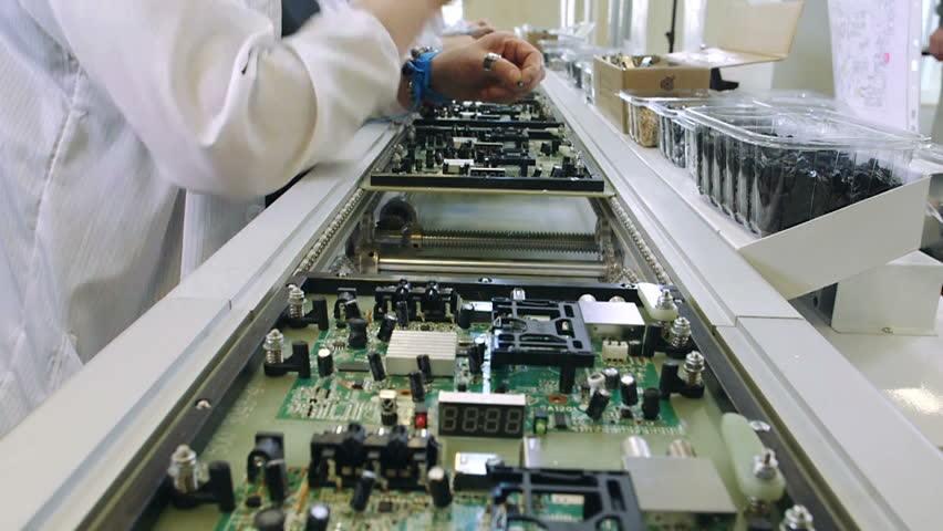 Workers Are Manufacturing Circuit Boards In Electronics Factory ...