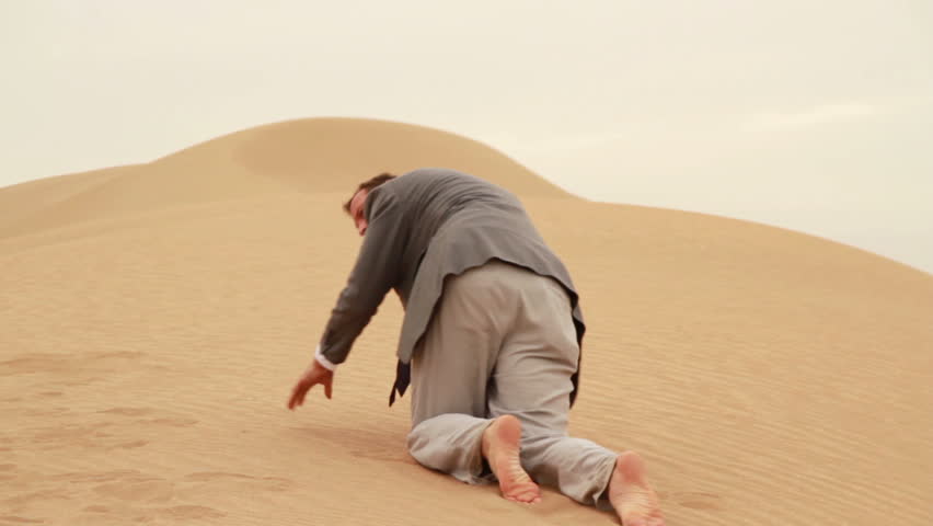 Exhausted Businessman Crawling In The Desert Stock Footage Video ...