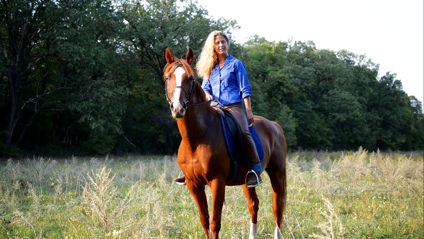 Young Blonde Girl Riding A Horse Stock Footage Video 2886526 - Shutterstock
