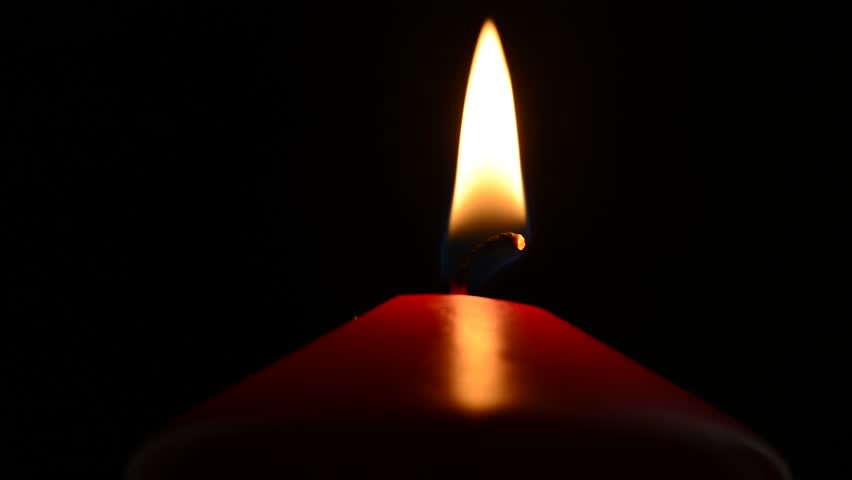 Blowing Out Candle On A Black Background. Constant Focus On Fire. Stock ...