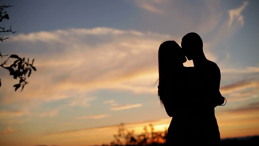 Silhouette Of Couple Holding Each Other. Medium Shot. Stock Footage ...
