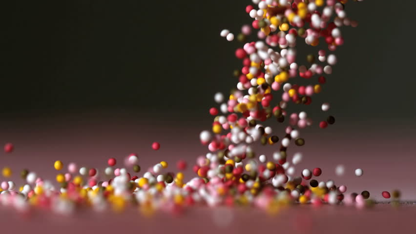 Sprinkles Falling On Pink Surface In Slow Motion Stock Footage Video ...