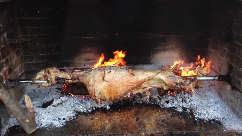 Spit Roasting Lamb In Fire Pit Stock Footage Video 4964636 - Shutterstock