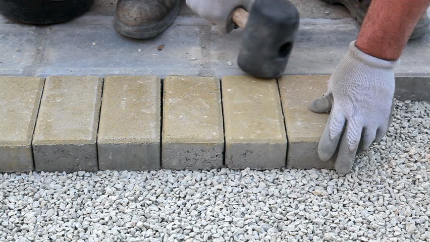 Worker Installing Brick Paver, Using Hammer Stock Footage Video 5923064 ...