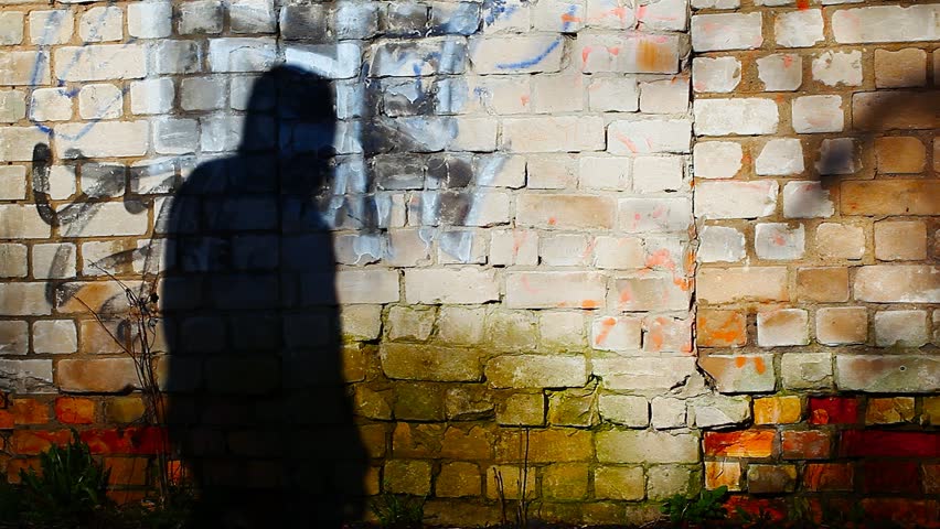 Shadow Of Two People Moving On The Brick Wall Stock Footage Video ...