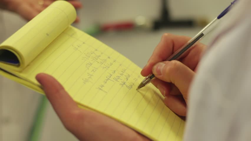 Person writing on paper