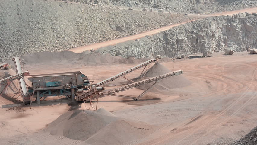 Mine Dump Trucks In Kennecott Copper Mine In Central Utah. Dumping Ore ...