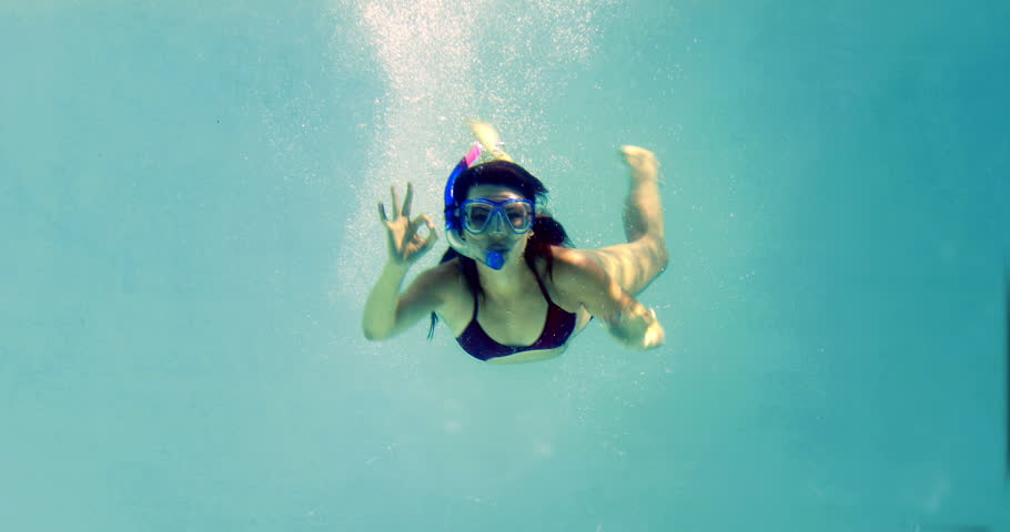 Pretty Brunette Swimming Underwater Into Pool With Snorkel On Her ...