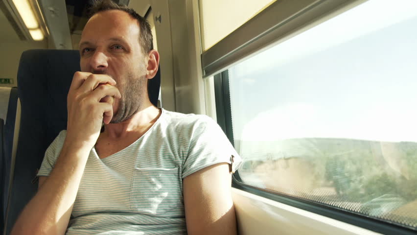 Young Man Eating Tasty Apple On A Train Stock Footage Video 8094373 ...