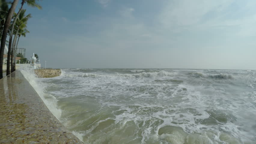 Hurricane Storm Surge Waves Crash Into Sea Wall. Large Waves Crash Into ...