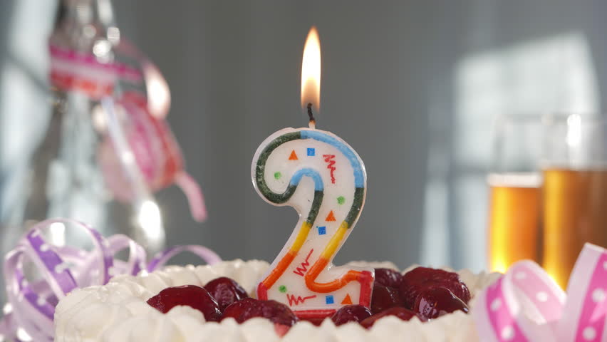 Birthday Candle (Number TWO) Burning On Top Of Cake Stock Footage Video ...