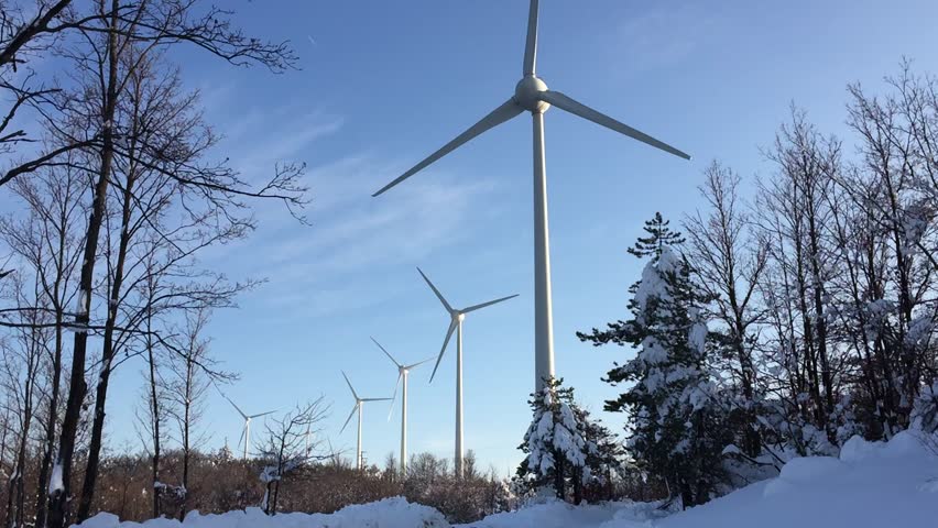 Wind turbines on snow winter landscape with dark blue sky. - HD stock ...