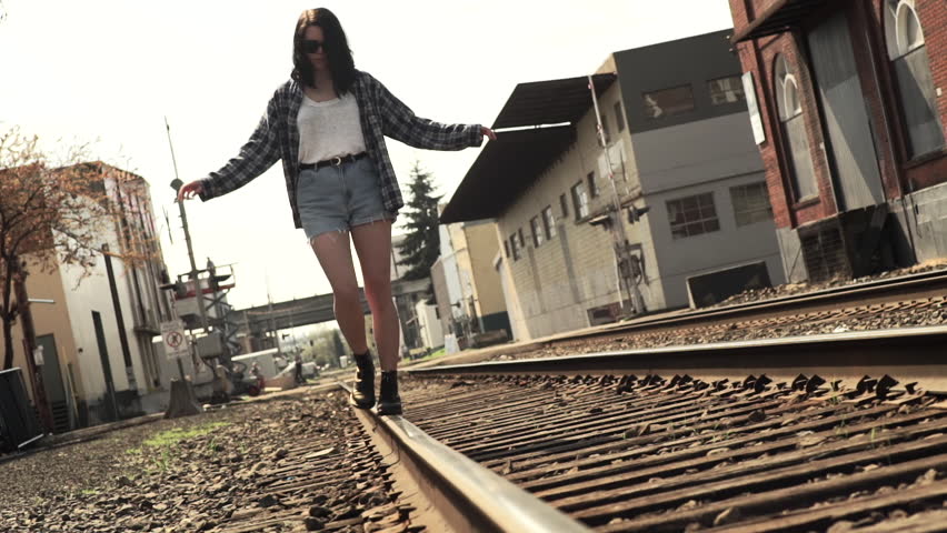 A Little Girl Walking Away, Down The Train Tracks. Stock Footage Video ...